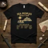 Black t-shirt with "Sea Peoples World Tour 12th Century BC" text and list of ancient locations, featuring a ship and