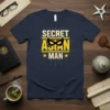 Secret Asian Man quote with a masked graphic on a navy blue t-shirt, celebrating Asian heritage and identity