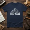 Self Made t-shirt with a white mountain graphic filled with gears and circuits, and the text "SELF MADE" below