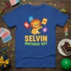 Selvin Birthday Boy t-shirt design with a cartoon lion wearing a crown and game cards, perfect for a child's birthday