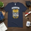 Senior Class of 2026 t-shirt design with open book and laurel wreath graphic