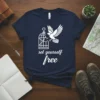 Navy t-shirt with white text "set yourself free" and a graphic of a bird flying out of a broken cage