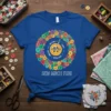 Blue t-shirt with colorful buttons in a circle and "SEW MUCH FUN!" text, surrounded by sewing supplies