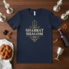 Navy t-shirt with "Shabbat Shalom" text, menorah, and grape cluster graphic in gold