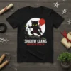 Shadow Claws Master of Stealth T-Shirt with a black ninja cat holding shurikens and a red sun graphic