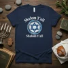 Navy t-shirt with "Shalom Y'all Shalom Y'all" text and a blue and white Star of David graphic