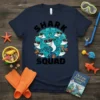 Shark Squad T-Shirt design featuring a circle of cartoon sharks wearing sunglasses, with the text "SHARK SQUAD" above and below