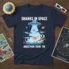 Sharks in space with a UFO abduction beam and text "Sharks In Space Abuction Tour '99" on a navy t-shirt