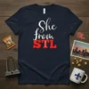 She from STL 314 T-Shirt design in white and red typography on a navy blue shirt