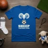 Blue t-shirt featuring a white graphic of a ram's head above a soccer ball, with "SHEEP FOOTBALL CLUB" text below