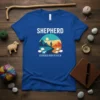 Shepherd Guides His Flock t-shirt with a landscape graphic of a person guiding sheep