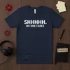 Navy t-shirt with white text SHHHHH. NO ONE CARES in bold sans-serif font