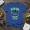 Shibuya Crossing Tokyo Japan graphic t-shirt design featuring a neon cityscape and pedestrian crosswalk illustration