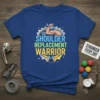 Shoulder Replacement Warrior text with graphic of arm holding wrench and gears on a blue t-shirt