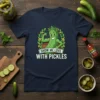 Show Me Love With Pickles T-Shirt featuring a muscular cartoon pickle character in a barrel, surrounded by leaves and flowers
