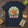 Vintage retro sunset design with the word SILKIE and a cute guinea pig illustration on a navy t-shirt