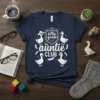 Silly Goose Auntie CLUB T-Shirt featuring four cartoon geese in various hats and accessories, with text "silly goose auntie CLUB"