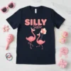 Silly Sister t-shirt with two pink flamingos wearing party hats, holding balloons, and the text "SILLY Sister" in pink