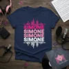 Navy t-shirt with "Simone Simone Simone Simone" repeated in pink and white, with sound wave graphics above and below