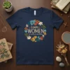 Navy blue t-shirt featuring the quote "Simple Women All Women of the Universe" surrounded by a colorful floral wreath design