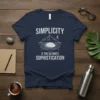 Simplicity Is The Ultimate Sophistication quote on a navy blue t-shirt with mountain and water graphic