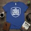 Blue t-shirt with white text "SINGLE LIVES MATTER" inside a shield emblem with a crown graphic