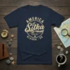 Vintage Sitka Alaska ESTD 1971 design with mountains, boat, and buildings on a navy t-shirt