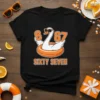 Black t-shirt with a cartoon swan wearing sunglasses and holding "6" and "67" numbers, with "SIXTY SEVEN" text below