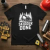 Black t-shirt with white text "SKIDDER DONE" and a graphic of a logging skidder machine in front of pine trees