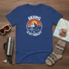 Skiing Is My Therapy quote with mountain and heartbeat graphic on a navy blue t-shirt