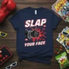 Navy t-shirt with "Slap Bam Zap Your Face" in bold retro comic style text, featuring a fist graphic and action