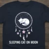 Sleeping Cat on Moon T-Shirt with dreamcatcher and celestial design, featuring a white cat