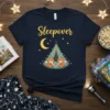 Sleepover Foxes T-Shirt design featuring two foxes in a tent under a crescent moon and stars, with the word "Sleepover"