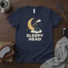 Navy t-shirt with "SLEEPY HEAD" text and a graphic of a cat sleeping on a cloud under a moon