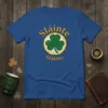 Blue t-shirt with "Sláinte Sláinte" text and a green shamrock inside a circular design, representing Irish toast