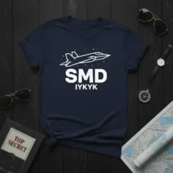 Navy t-shirt with white outline of a modern fighter jet above the text "SMD IYKYK"