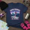 Navy t-shirt with "SNOW WORRIES GO SKIING!" text and a graphic of a snowboarder mid-air against snowy mountains