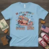 Light blue t-shirt with "So Long London Had A Good Run" text and a cartoon double-decker bus designed with American