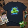 Navy t-shirt with "SO WHAT" in bright green, outlined text against a colorful pop art explosion graphic