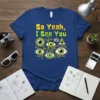 So Yeah, I See You text design with multiple green and blue eyes and circuit board graphics on a navy
