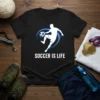 Black t-shirt with white text "SOCCER IS LIFE" and a graphic of a soccer player in action