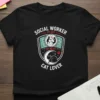 Social Worker By Day By Night Cat Lover t-shirt design featuring shield graphic with people, moon, cat, and paw print