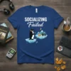Socializing Failed T-Shirt with a penguin wearing headphones and looking at a phone, with other penguins by a campfire in