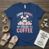 Some Bunny Needs Coffee t-shirt design with a sleeping bunny holding a coffee cup surrounded by Easter eggs