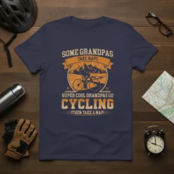 T-shirt design featuring text "Some Grandpas Take Naps Super Cool Grandpas Go Cycling (Then Take A Nap)" with a graphic