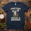 Navy blue t-shirt with "SOMETHING SPECIAL IS BREWING" text and a graphic of a brewing fermenter with hops