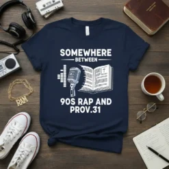 Navy t-shirt with "Somewhere Between 90s Rap and Prov.31" text, featuring a vintage microphone and open Bible graphic