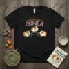 Black t-shirt with "SORRY I CAN'T I HAVE PLANS WITH MY GUINEA" text and three cartoon guinea pigs, one reading