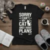 Sorry I Can't My Cats And I Have Plans text with cute cat graphic on black t-shirt