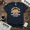 Sorry I'm Late My Cat Was Sitting On Me text with a cute sleeping cat graphic on a navy t-shirt